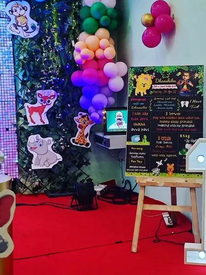 A close-up of the personalized milestone chalkboard for the woodland-themed party, a wonderful detail that celebrates the baby's first year.