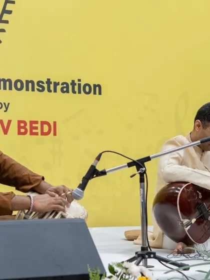 A wide view of a classic Sitar-Tabla 'Jugalbandi' performance. This format is perfect for audiences who appreciate the intricate rhythmic and melodic conversations between the two instruments.