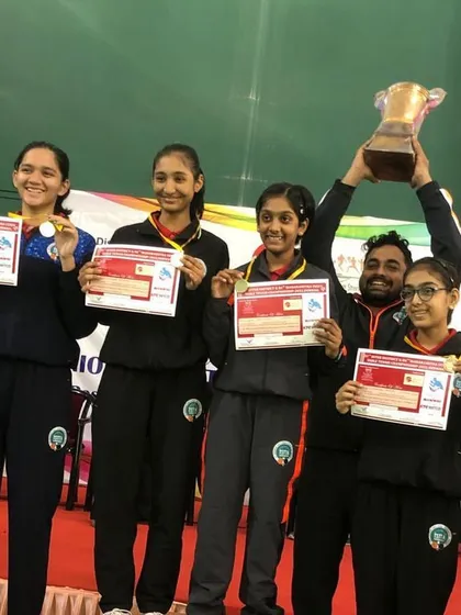 Victory tastes sweet. Here I am with our triumphant U-15 girls' team, celebrating a hard-earned gold medal at the Maharashtra state championship. This is what team spirit and dedication look like.