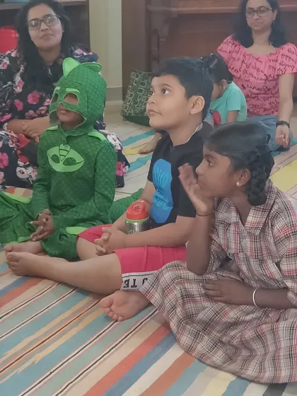 The focused expressions of our young audience, including one little hero in costume, show just how engaging our stories are. We create an atmosphere where imagination can truly run wild.