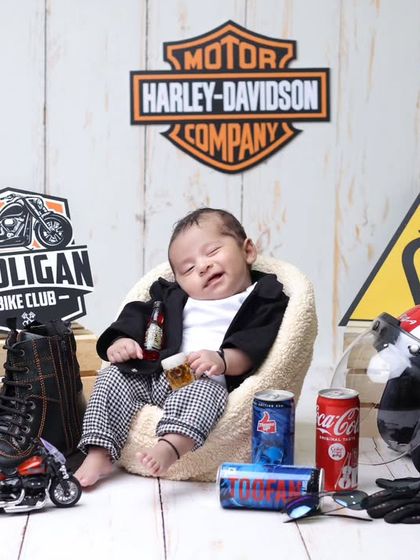 A full view of the biker baby setup. We love creating these fun, personality-filled photoshoots that reflect the parents' hobbies and passions.