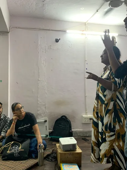 A participant passionately shares her thoughts during a discussion. We create an environment where every voice is valued and respected.