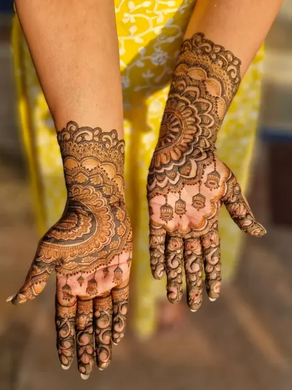 A lovely mandala design done by my team for a wedding guest. The hanging jhumka motifs add a festive touch.