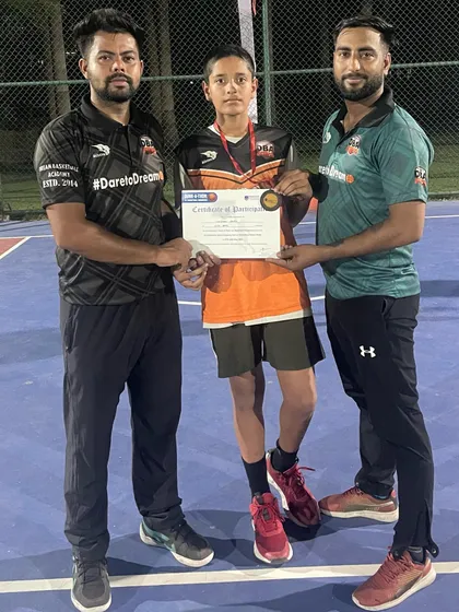 Presenting Krishna with a certificate and a bronze medal for his excellent performance in a recent tournament. Every achievement is a step forward.