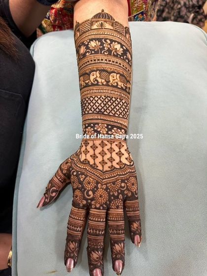 The back of a traditional bridal hand. This design features a majestic dome, elephant bands, and intricate jaali and floral patterns, showcasing elegance from every angle.