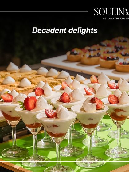 A display of decadent delights, including strawberry trifles in martini glasses. Our year-end celebrations are filled with sweet temptations.