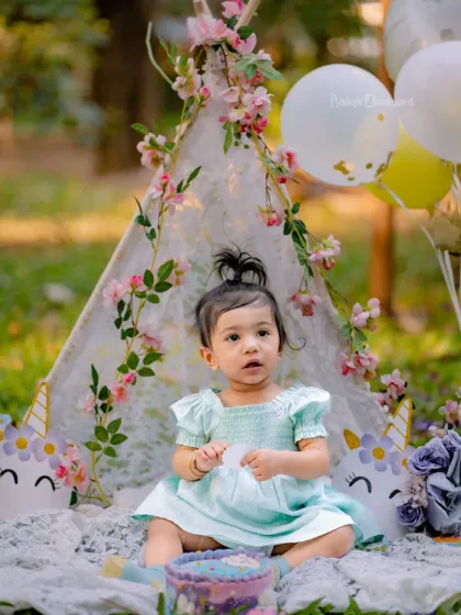 A little princess in her magical unicorn wonderland. This outdoor setup is perfect for a whimsical birthday.