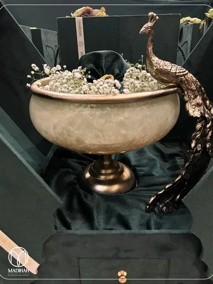 The Peacock Bowl Hamper, shown here in its luxurious velvet packaging, ready to make a grand statement.