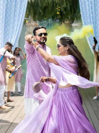 A candid moment during a choreographed pool party entry. Our goal is to create moments of pure fun and joy, letting your personalities shine even during a planned routine.
