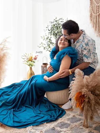 A sweet kiss for the mama to be. These tender interactions create the most heartfelt and memorable maternity photographs.