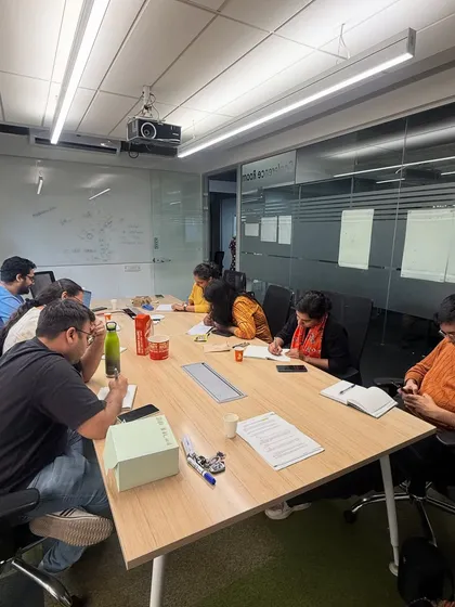 A typical scene from our workshop: writers deeply engaged in their notes during a session. These are not passive lectures; they are active, participatory experiences where everyone contributes.