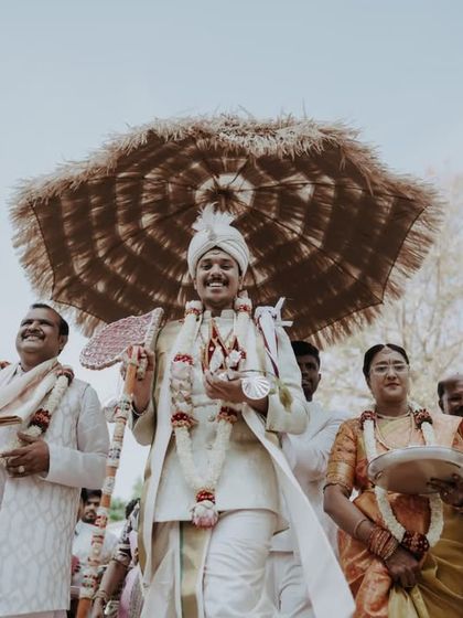 The groom's procession during the Kashi Yatre, surrounded by his happy family.