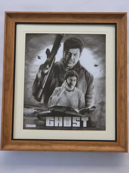 Beyond traditional portraits, I also love taking on creative challenges. This is a custom charcoal drawing inspired by the poster for the movie 'Ghost', a tribute to the actor Shivarajkumar. It took nearly 50 hours to complete this A1 size artwork.