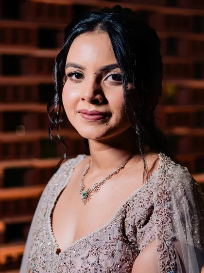 A close-up of Shilpi's elegant Sangeet look. She requested a soft glam style to go with her heavily embroidered lehenga. The result is a classic and timeless look that is both sophisticated and beautiful.