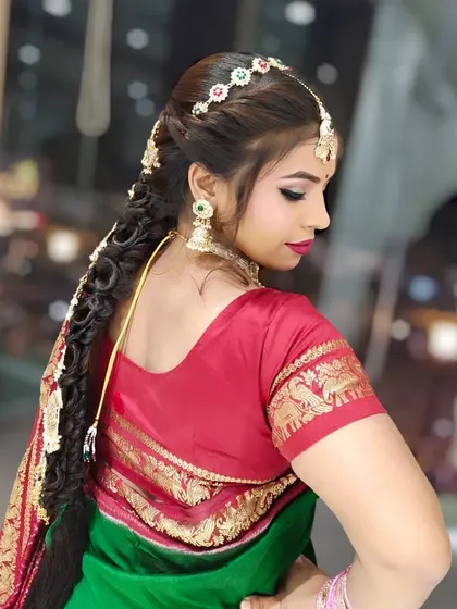 Beyond salon cuts, I also design intricate hairstyles for special occasions. This is a traditional bridal braid I created, complete with beautiful hair accessories for a complete look.