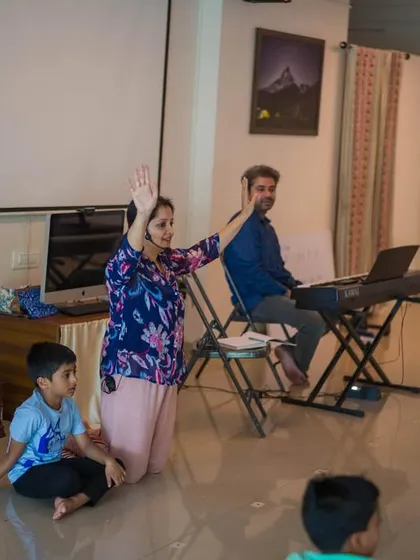 Here, the workshop transforms into an impromptu singing session. The joy in the room is palpable as children express themselves freely, reminding us that mindfulness can be found in laughter and song.