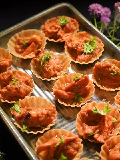 I love adding a creative twist to classic flavors. These Butter Chicken Tarts are a perfect example, featuring my creamy, rich butter chicken filled into bite-sized, crispy tart shells. They are a unique and popular appetizer for parties and events.