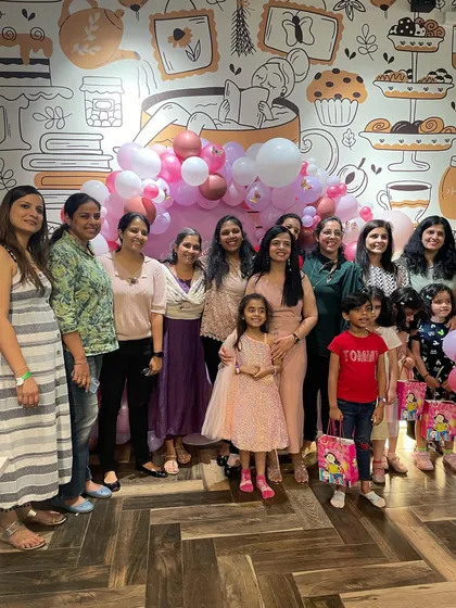 A big group photo of all the moms and kids at a birthday party. We love hosting large gatherings where friends and families can all celebrate together in one place.