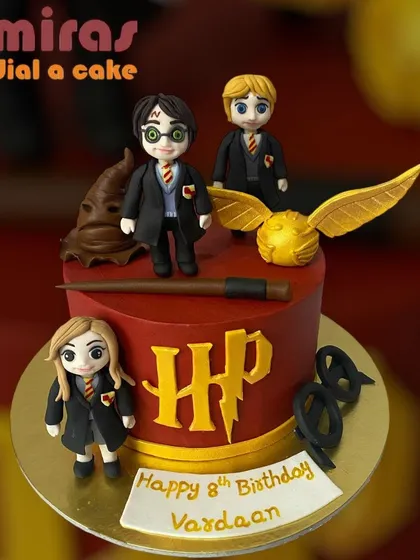 Step into the wizarding world with this detailed Harry Potter cake. It features hand-sculpted figurines of Harry, Ron, and Hermione, the golden snitch, a magic wand, and the iconic HP logo, all crafted from fondant for a truly magical birthday.
