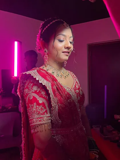 A candid moment during the getting-ready process, showing the final touches.