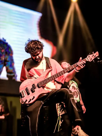 Our bassist, deep in concentration, delivering a tight and powerful performance.