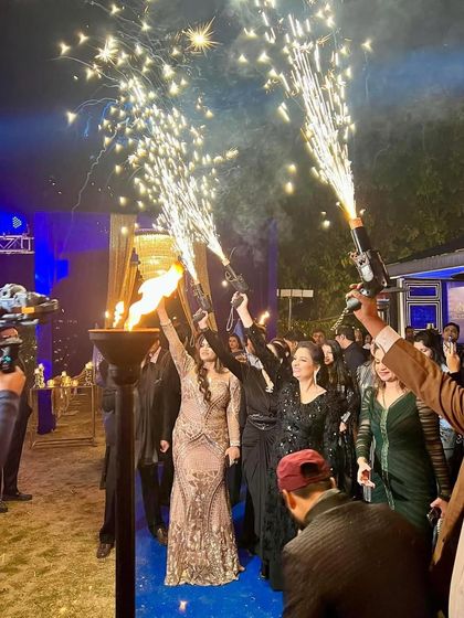 The grand entrance for "The Royals" New Year's Eve party. Guests were welcomed with sparklers and a torch, creating a dramatic and celebratory start to the night.