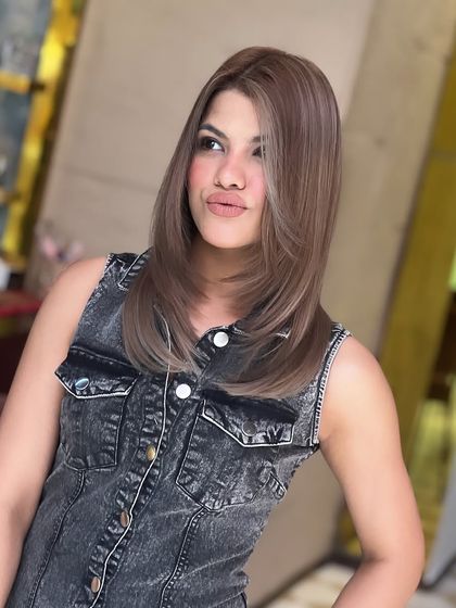 This side profile highlights the clean lines of the haircut and the uniform, cool tone of the global colour.