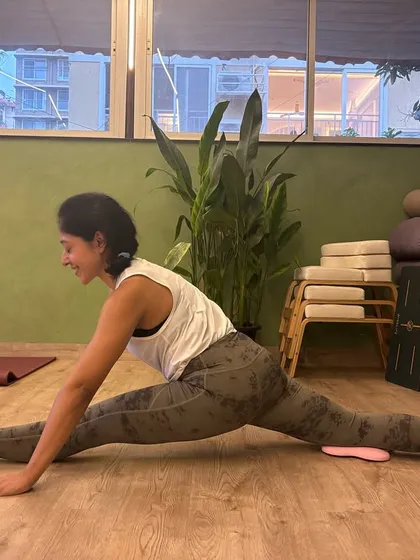 Working towards the splits with the help of sliders. We use creative props to make challenging goals like this achievable.