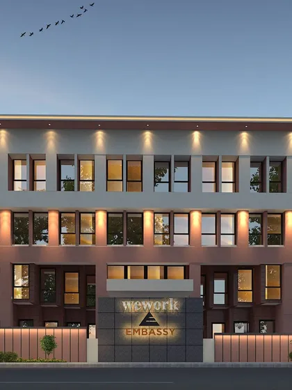 A frontal 3D render of the WeWork Embassy building facade.