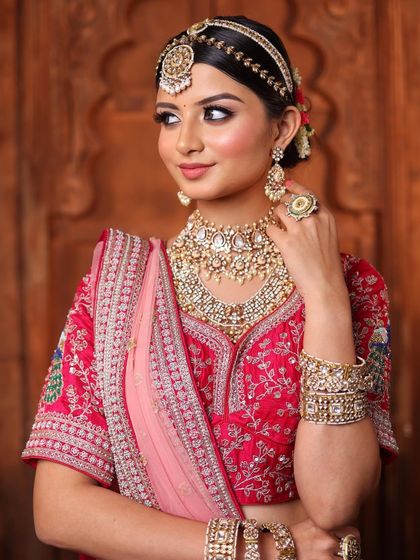 A portrait of poise and grace. The soft, glowing makeup enhances her natural beauty, allowing her to shine with confidence on her special day.