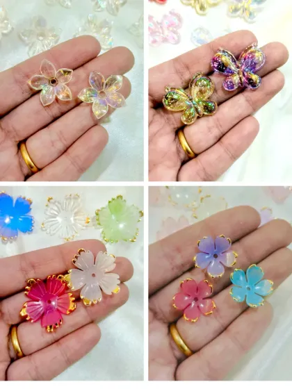 These colorful flower and butterfly add-ons are great for jewelry making or decorating small resin items. They come in a variety of bright colors with gold accents.