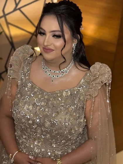 Our client looking radiant and happy in her final reception look. The makeup enhances her features and gives her a beautiful, celebratory glow.