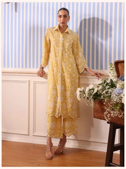 A sunny yellow co-ord set with a long shirt and scalloped pants. This is a perfect outfit for a bright, happy day.