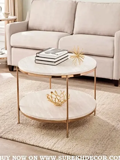 This elegant round center table features a two-tiered design with a beautiful rose gold finish. The white marble-like surfaces provide ample space for books and decor, making it a stylish and functional addition to any living room.