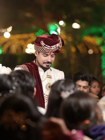 The groom making his way through the crowd, a candid moment filled with energy and anticipation.