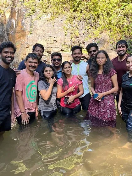 A smaller group enjoying the refreshing waterfall on the Netravati trip.