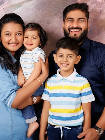 A beautiful family of four. Studio portraits are a fantastic way to get a sharp, well-lit photograph where everyone looks their best.