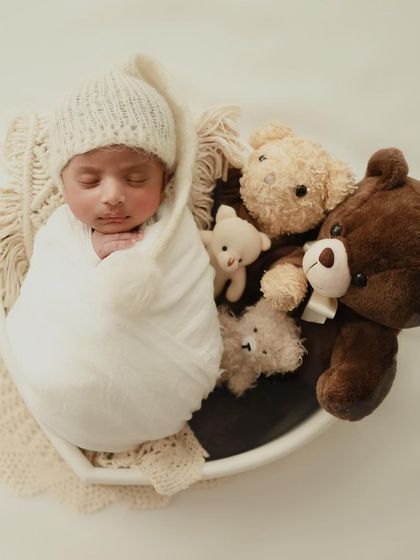 One of my little teddies. A simple bowl prop filled with cozy blankets and teddy bears makes for an adorable and timeless newborn photo.
