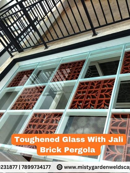 A pergola that combines toughened glass with decorative jali brick inserts. This unique design allows for natural light while adding an element of traditional artistry.