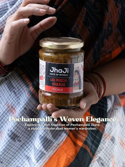 This image from our Hyderabad series showcases the beautiful Pochampalli Ikat saree, a staple in Hyderabadi women's wardrobes, alongside our pickle.