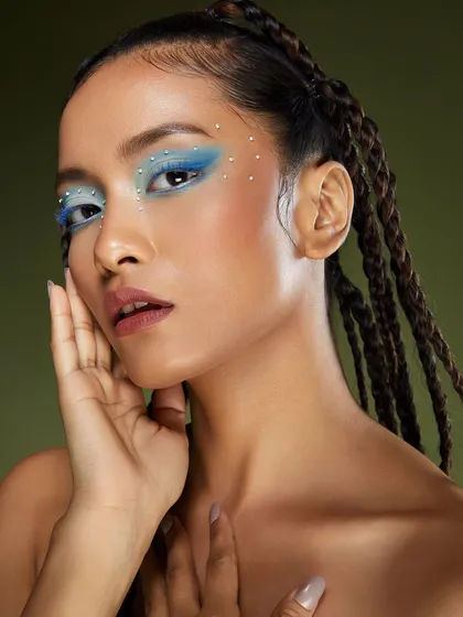 Another pose from the icy blue look, showing the full effect of the makeup and hair. Our portfolio shoots capture a variety of stunning angles.