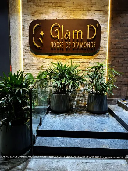 First impressions matter. For the 'Glam D' House of Diamonds, we designed an elegant entrance using a trio of potted palms and sophisticated lighting to create a welcoming and luxurious atmosphere for their clients.