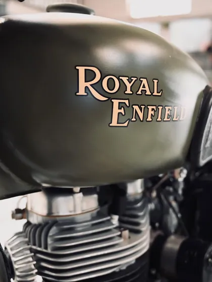 The details matter, especially on a classic. This is the hand-painted tank logo on a 1955 Royal Enfield Bullet we fully restored, bringing it back from the dead to its original glory.