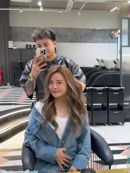 Another selfie angle, capturing the joy of a fresh new hair color. This ash blonde is a perfect example of a modern, stylish look.