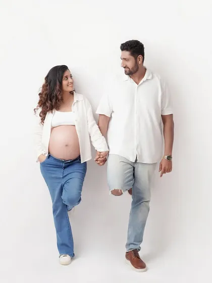 A maternity photoshoot can also be relaxed, fun, and casual. This couple's session with simple white shirts and jeans shows that celebrating your baby bump can be as simple and natural as your love for each other.