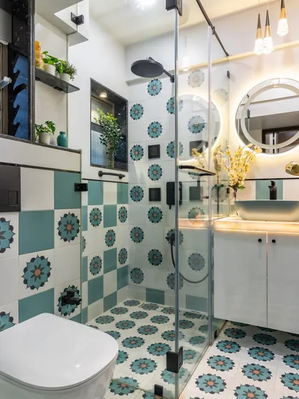 We believe bathrooms should be as beautiful as any other room. Here, vibrant, custom-patterned tiles create a joyful and artistic statement, turning a functional space into a personal sanctuary filled with character.