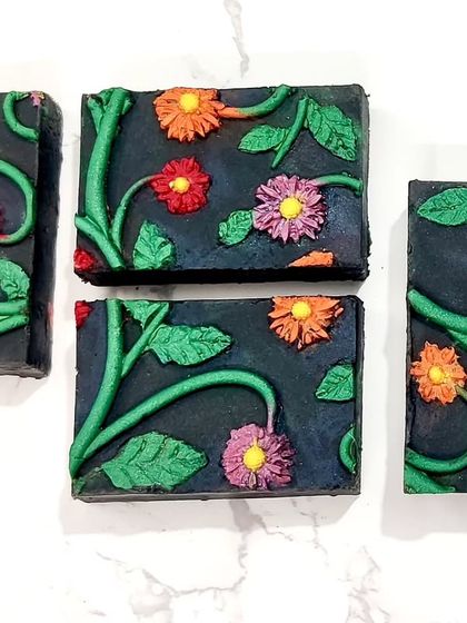 The final cut bars of my floral impression soap. Pouring the different colors for the flowers and leaves took a lot of patience, but it was worth it.