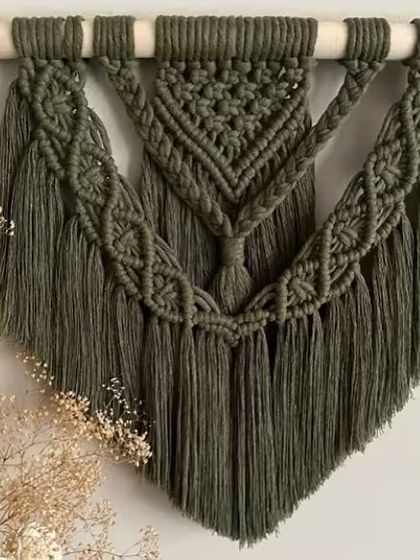 I also create my bohemian wall hangings in different colors. This piece in a deep olive green adds a touch of nature-inspired color and sophisticated texture to the wall.