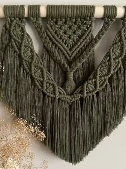 I also create my bohemian wall hangings in different colors. This piece in a deep olive green adds a touch of nature-inspired color and sophisticated texture to the wall.