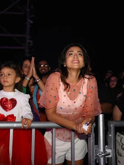 A mother and child enjoying the show together. Our concerts are for fans of all ages, creating core memories across generations.